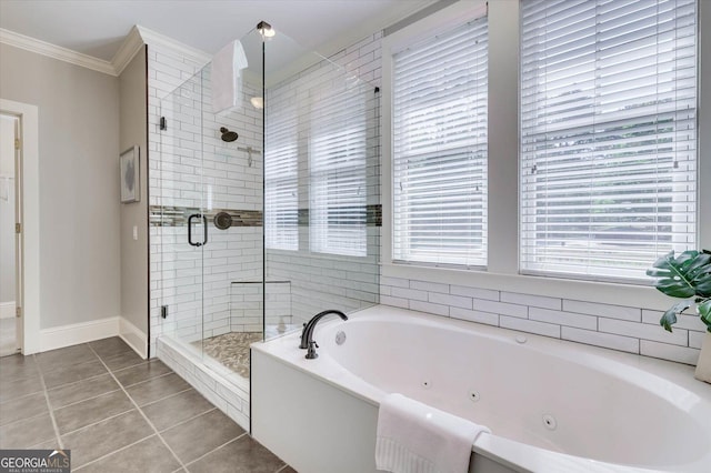 bathroom with tile patterned floors, ornamental molding, and shower with separate bathtub