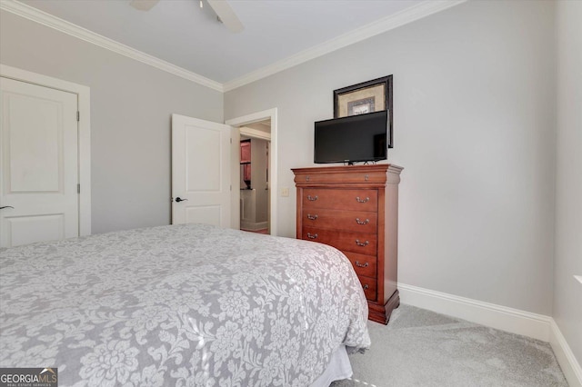 carpeted bedroom with ceiling fan and ornamental molding