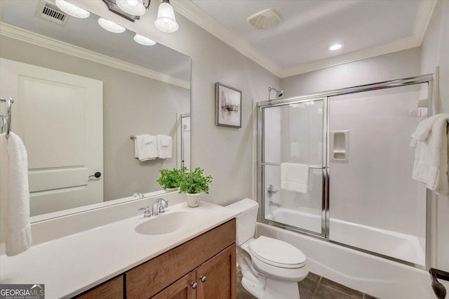 full bathroom with crown molding, tile patterned flooring, toilet, shower / bath combination with glass door, and vanity