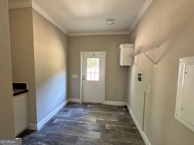 washroom with ornamental molding, hookup for a washing machine, and dark hardwood / wood-style floors