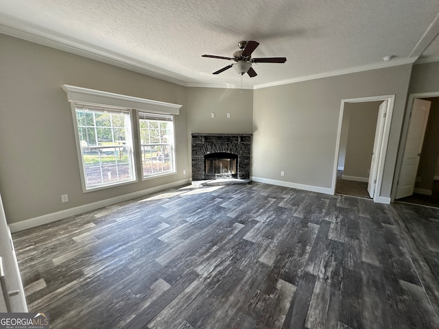 unfurnished living room with a stone fireplace, crown molding, and dark hardwood / wood-style flooring