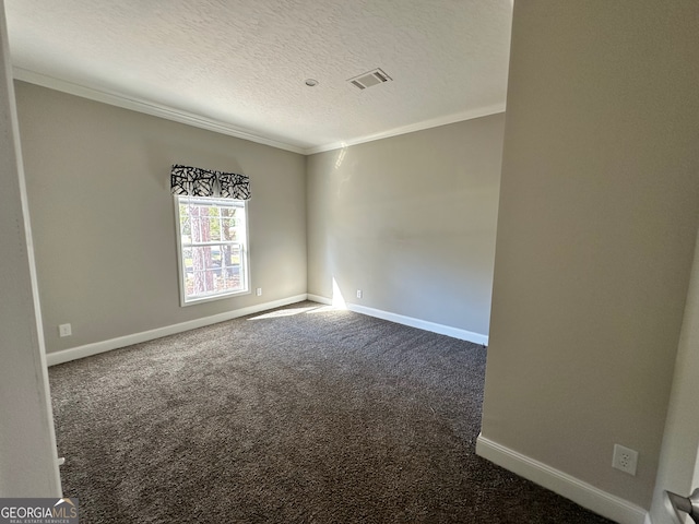 carpeted spare room featuring crown molding and a textured ceiling