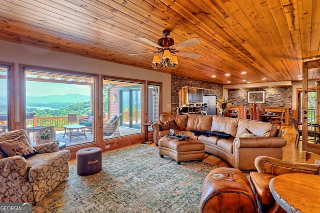 living room featuring wood ceiling, plenty of natural light, a mountain view, and hardwood / wood-style floors