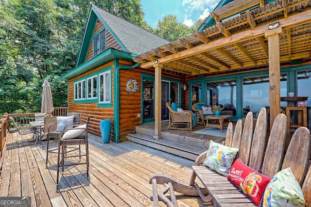 deck featuring outdoor lounge area and a pergola