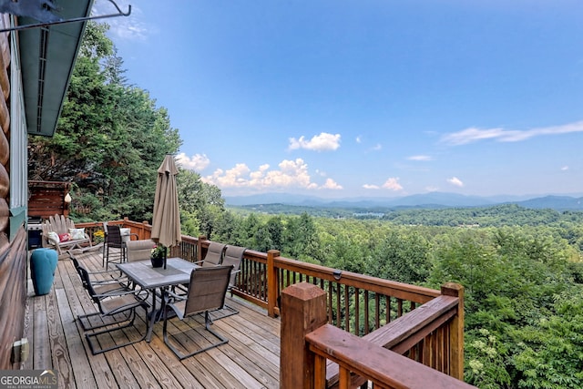 wooden deck featuring a mountain view