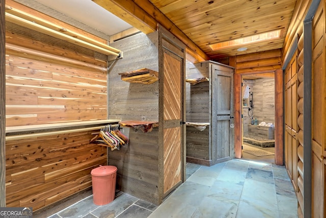 spacious closet with light tile patterned floors