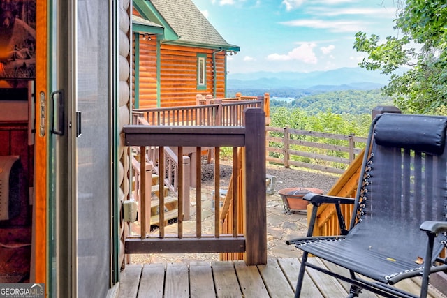 wooden terrace featuring a mountain view