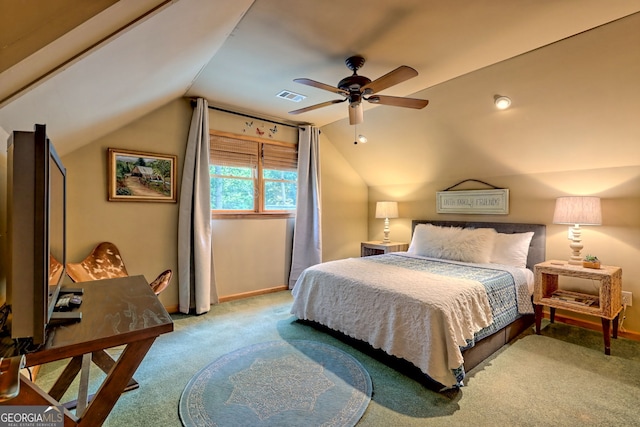 carpeted bedroom with vaulted ceiling and ceiling fan