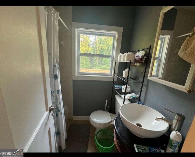 bathroom with sink and toilet