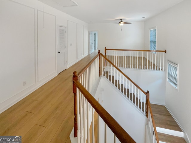 stairs featuring hardwood / wood-style flooring