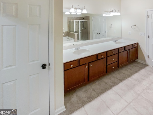 bathroom featuring tile patterned floors, walk in shower, and vanity