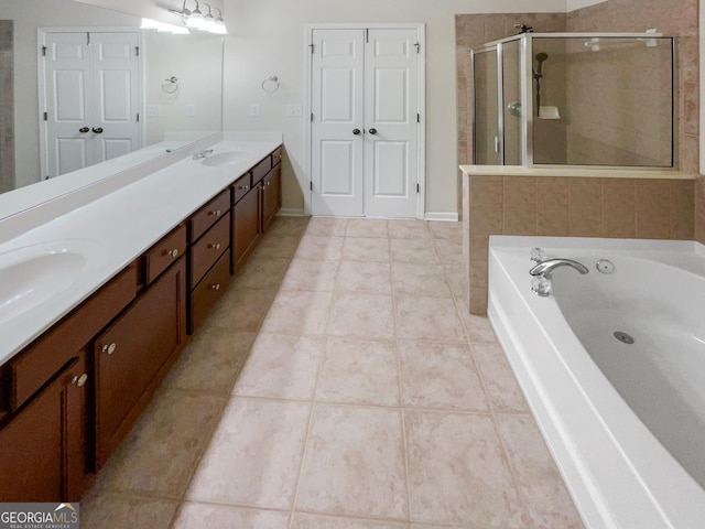 bathroom with vanity, tile patterned floors, and plus walk in shower