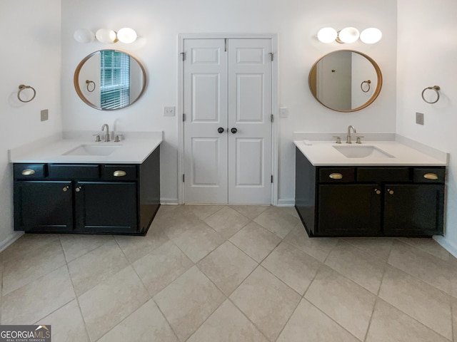 bathroom featuring vanity and tile patterned flooring