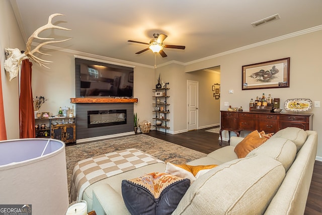 living room featuring ornamental molding, ceiling fan, and dark hardwood / wood-style flooring