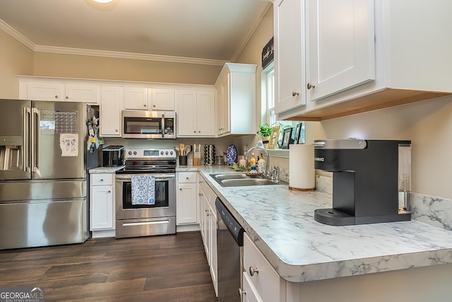 kitchen with stainless steel appliances, ornamental molding, sink, and white cabinets