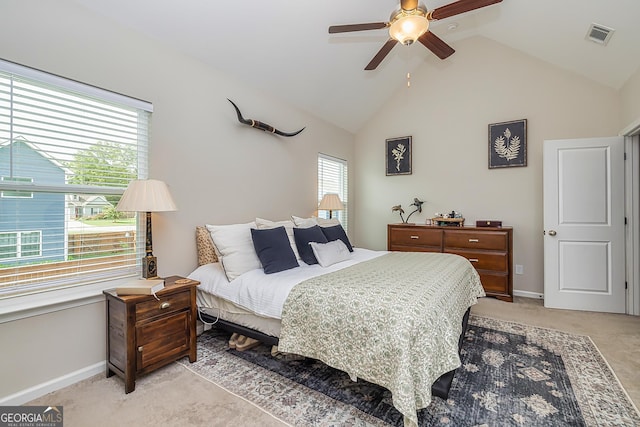 carpeted bedroom featuring ceiling fan and lofted ceiling