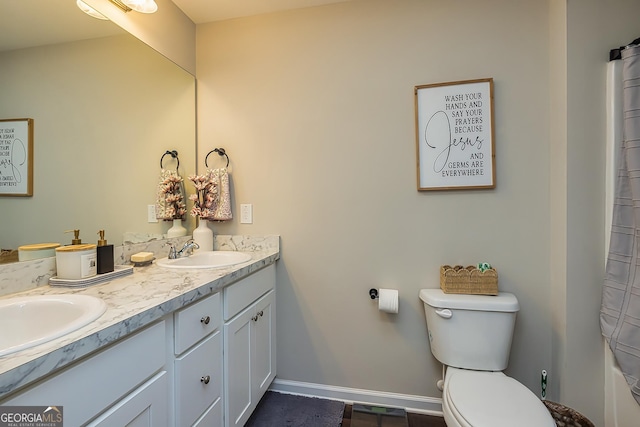 bathroom with vanity and toilet