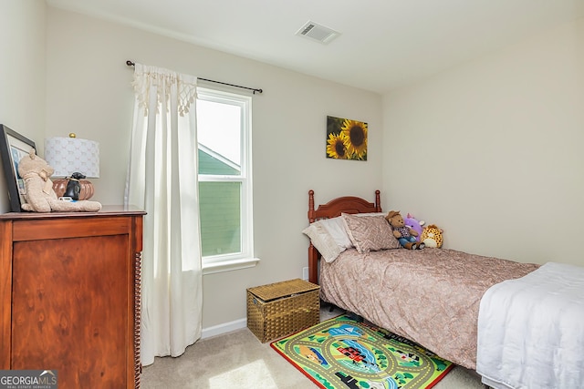 bedroom featuring light carpet