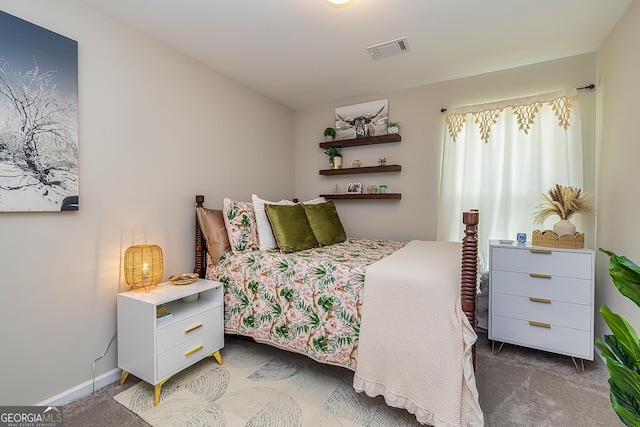 bedroom featuring dark colored carpet