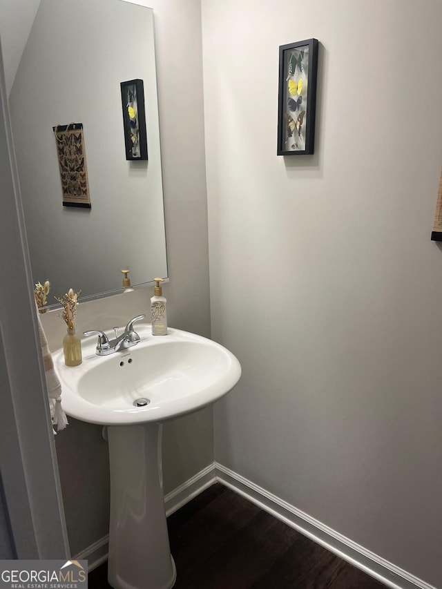 bathroom featuring hardwood / wood-style floors and sink