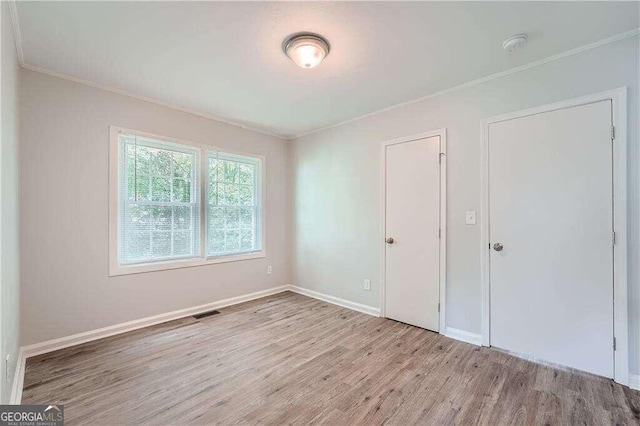 unfurnished bedroom with light hardwood / wood-style floors