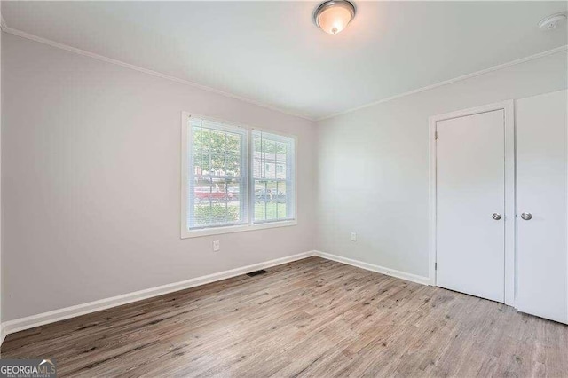 unfurnished bedroom with light wood-type flooring