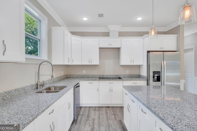 kitchen featuring light stone counters, sink, white cabinetry, and appliances with stainless steel finishes