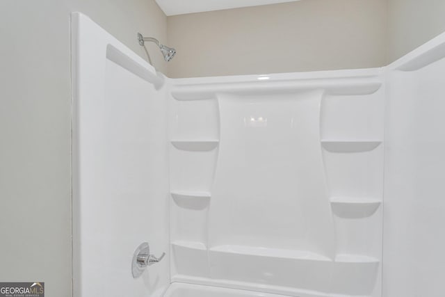 bathroom with shower / bathtub combination