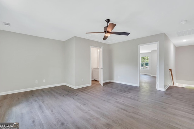 unfurnished room featuring hardwood / wood-style flooring and ceiling fan