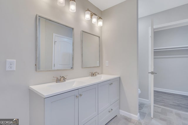 bathroom with toilet and vanity