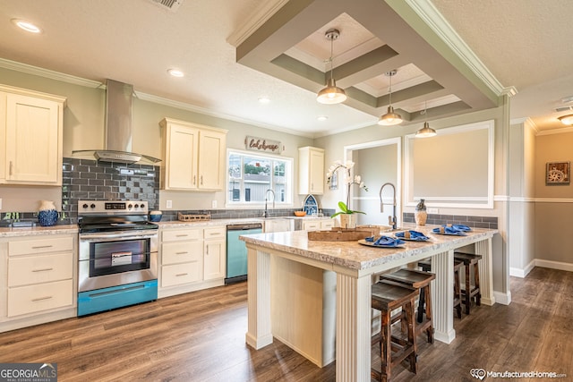 kitchen featuring a kitchen breakfast bar, decorative light fixtures, wall chimney exhaust hood, appliances with stainless steel finishes, and dark wood-type flooring