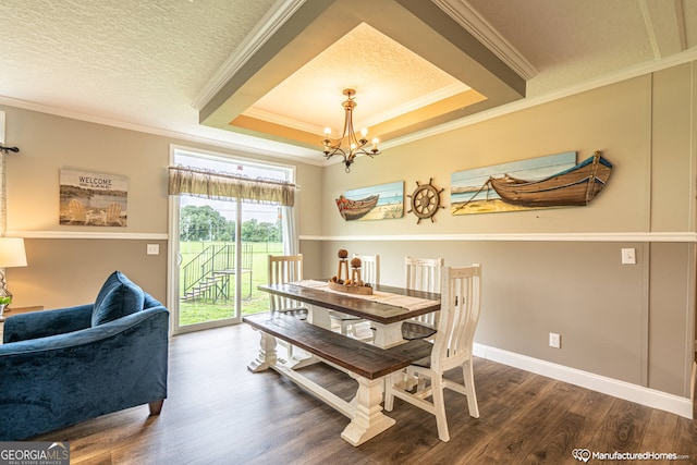 dining area featuring crown molding, a textured ceiling, a notable chandelier, and dark hardwood / wood-style floors