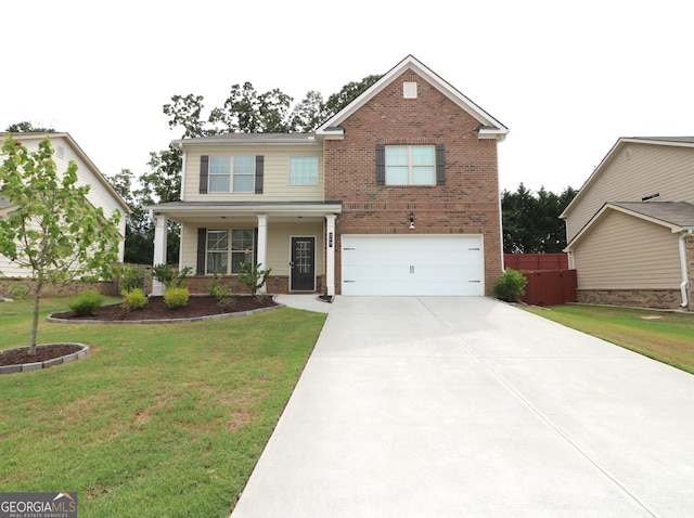 view of front of property featuring a garage and a front yard