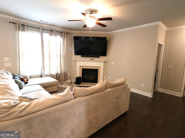 living room with ceiling fan, crown molding, and dark wood-type flooring