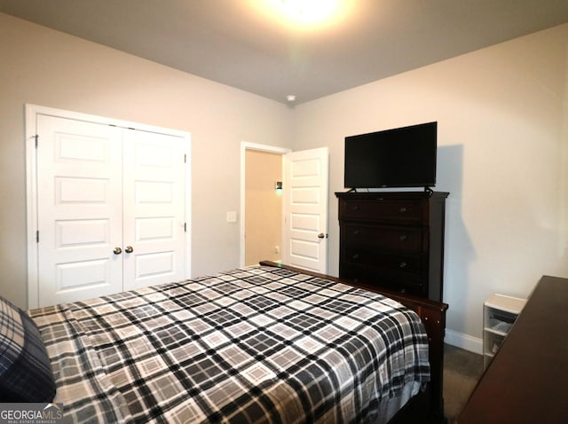 carpeted bedroom with a closet