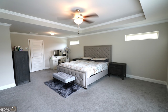 carpeted bedroom with a raised ceiling, crown molding, and ceiling fan