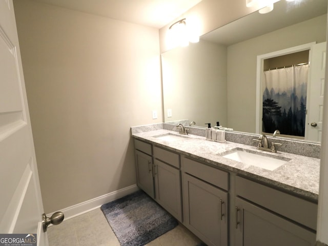 bathroom featuring tile patterned floors and double vanity