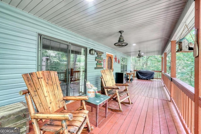 wooden terrace with a porch