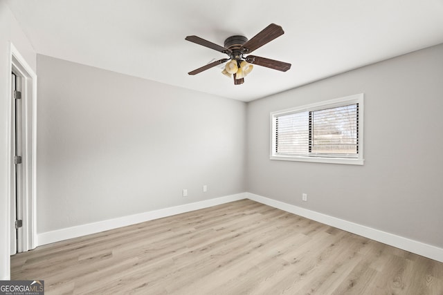 empty room with ceiling fan and light wood-type flooring