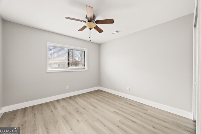 unfurnished room with ceiling fan and light wood-type flooring