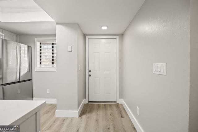 entryway with light hardwood / wood-style floors