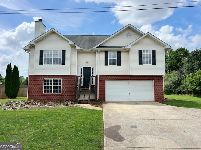 bi-level home featuring a garage and a front yard