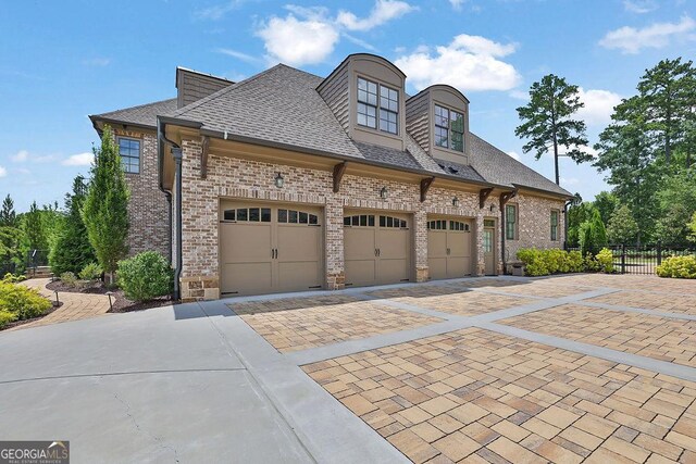 view of side of property with a garage