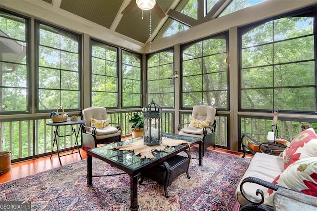 sunroom / solarium featuring ceiling fan and vaulted ceiling