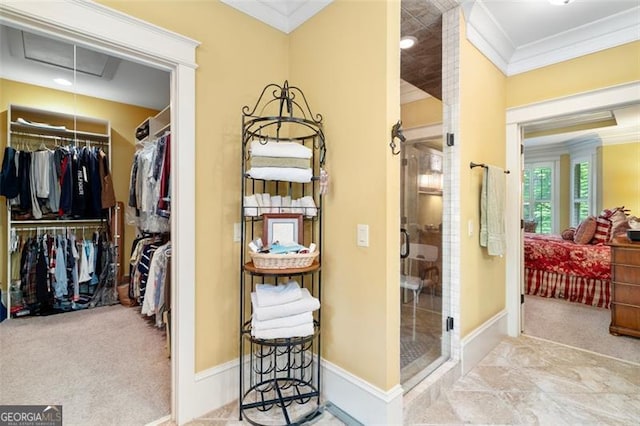 walk in closet featuring light carpet