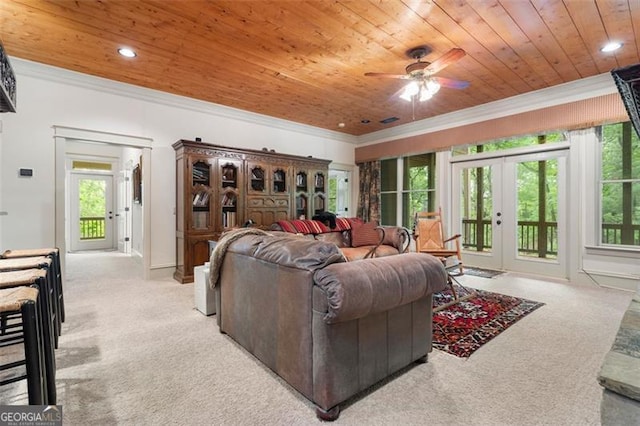 living room featuring french doors, ceiling fan, wooden ceiling, light carpet, and ornamental molding