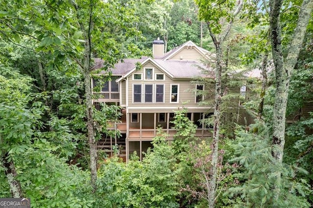 rear view of house with a deck