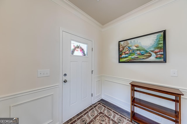 foyer entrance with crown molding and hardwood / wood-style flooring