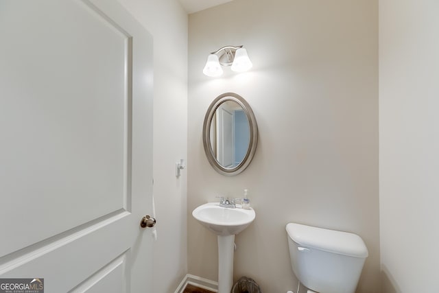 bathroom featuring sink and toilet