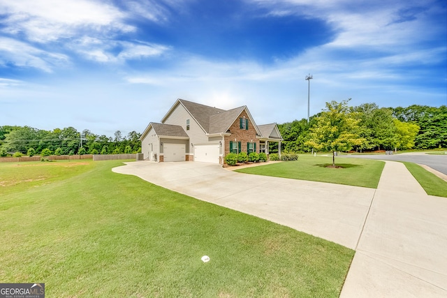 view of front of home featuring a front lawn and a garage